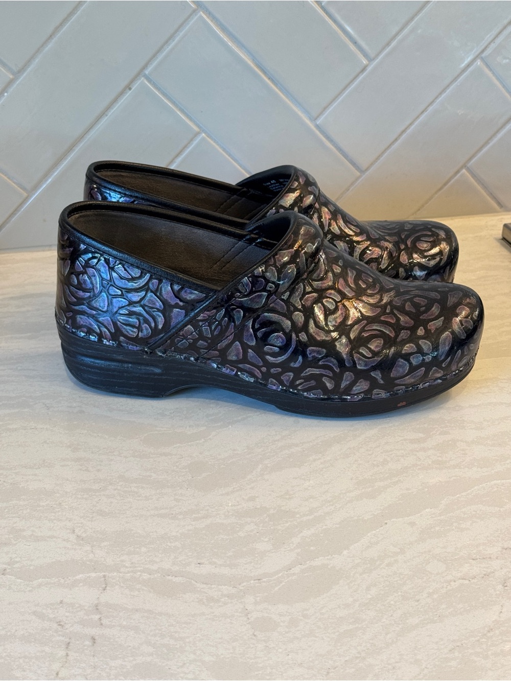 Dansko Iridescent Black Floral-Patterned Clogs